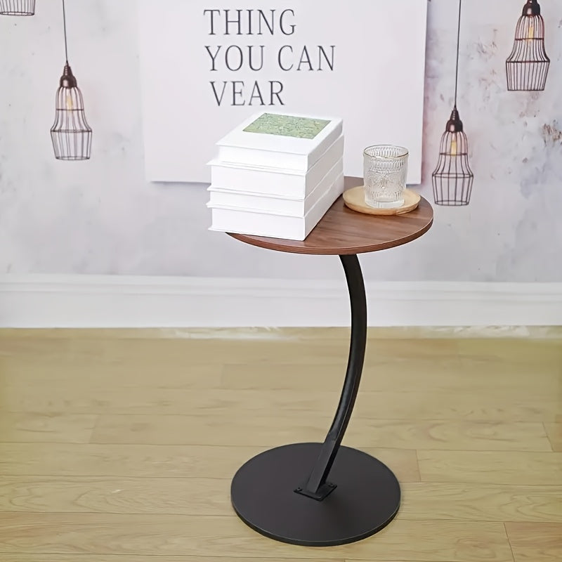 A Modern And Minimalist Columnar - Footed Table with A Metal Frame And A Wooden Tabletop. It Features A Portable Design, Making It Convenient for Indoor Use.