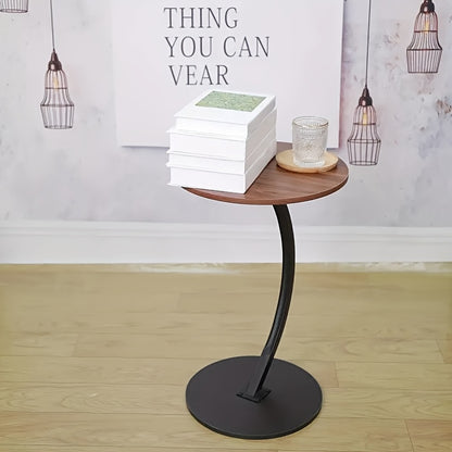 A Modern And Minimalist Columnar - Footed Table with A Metal Frame And A Wooden Tabletop. It Features A Portable Design, Making It Convenient for Indoor Use.